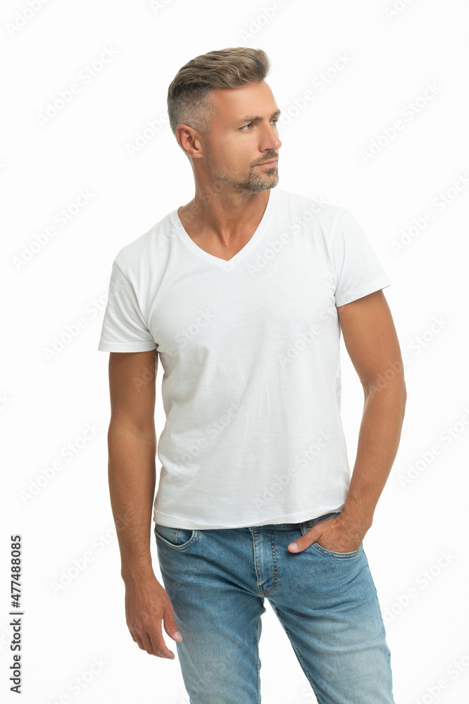 This is what handsome look like. Handsome guy in white tshirt. Caucasian man keep hand in pocket This is what handsome look like. Handsome guy in white tshirt. Caucasian man keep hand in pocket
