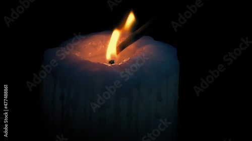 Big Candle Lit And Blown Out In The Dark photo