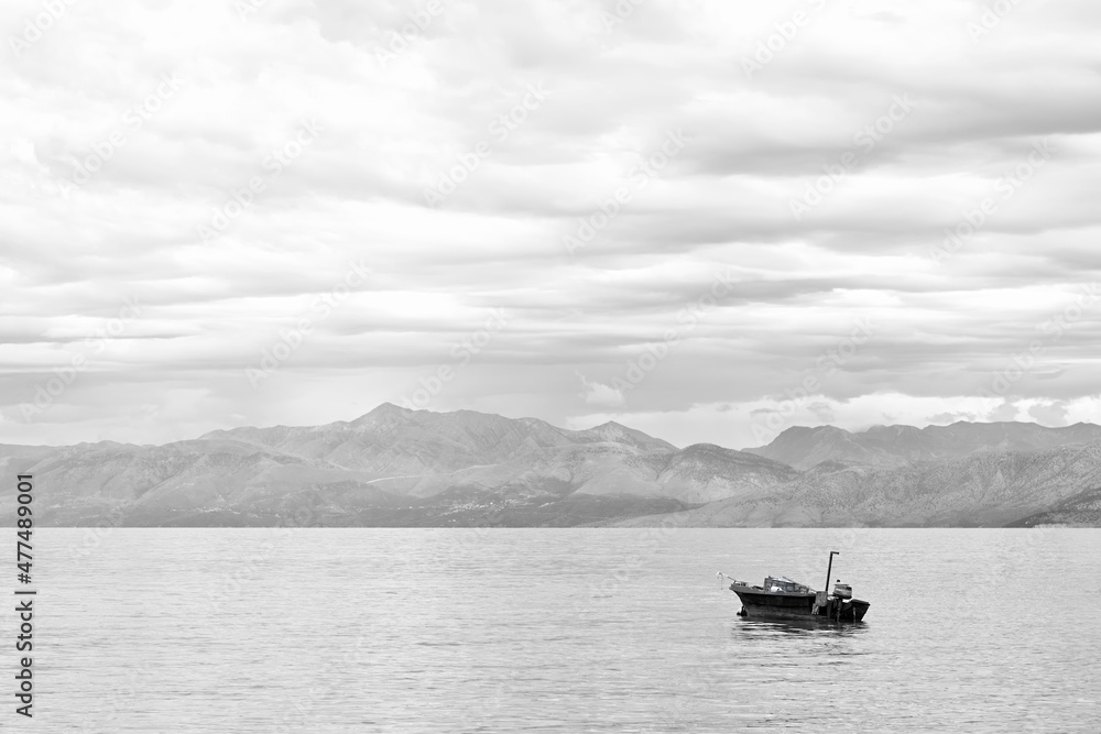 Fishing boat on the sea on a cloudy day