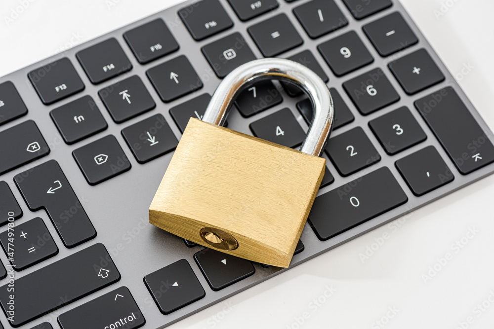 Golden metallic lockpad on the black keyboard. Golden metallic lockpad on the black keyboard.