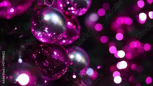 Red and white festive lights on the Christmas balls of the city Christmas tree