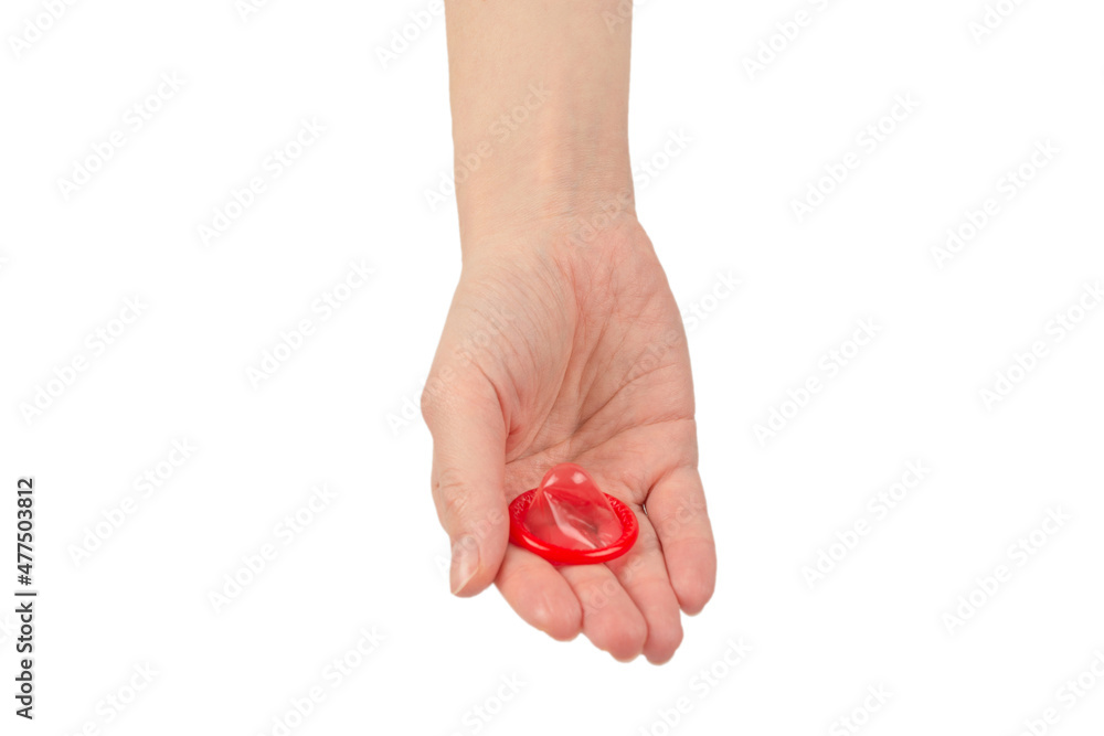 Condom in woman hand isolated on white background. Condom in woman hand isolated on white background.