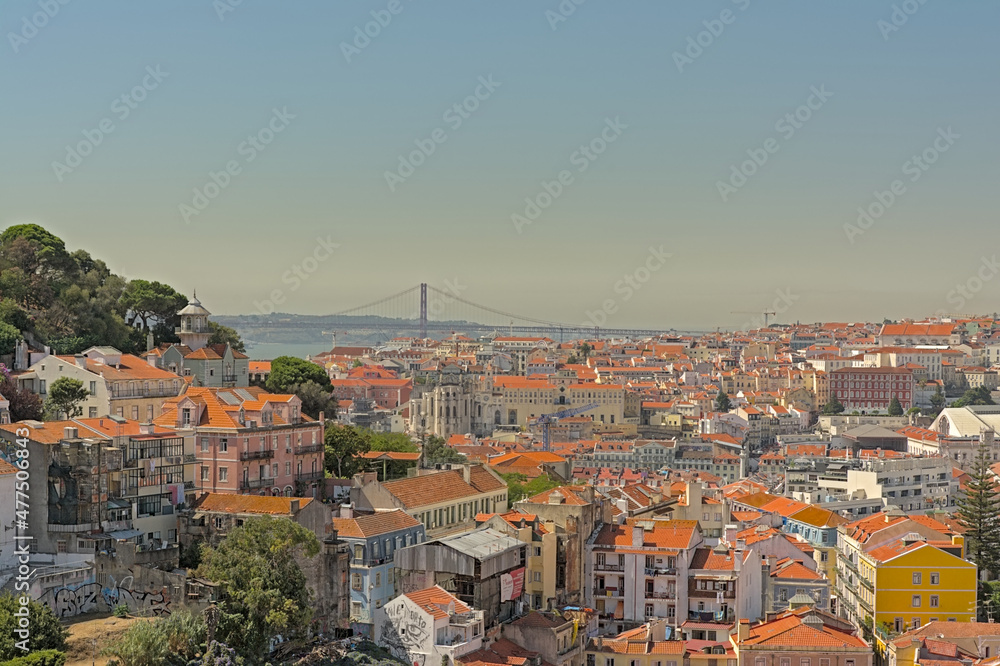 Rooftops of the houses of Lisbon, with Tagus river in the background, Portugal
