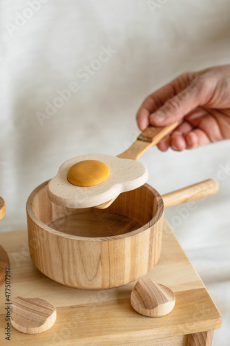 coocking process with wooden eco toys from naatural material for educating children. Funny game with eco toys