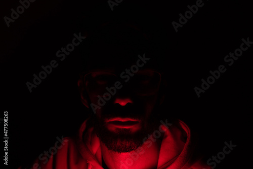portrait with red light black background
