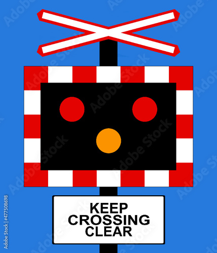 Open level crossing without gate or barrier where trains and vehicles are crossing the road at the same time