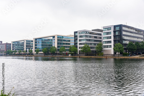 Modern office buildings in a redevelopped area on a former river harbour on a cloudy day. Duisburg, Germany.