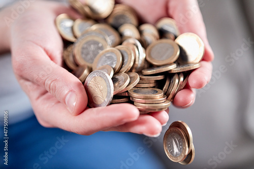 euro coins in the hands