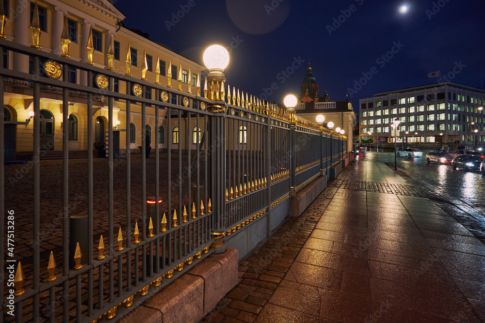 The capital of Finland Helsinki at night: Presidential Palace, the Orthodox Uspensky Cathedral, city lights, the Moon.