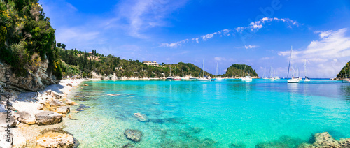 Splendid beaches of Paxos. Ionian islands of Greece .Beautiful turquoise bay in Lakka. view with sailing boats. Greek summer vacation