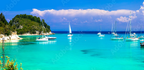 splendid beaches of Paxos. Ionian islands of Greece .Beautiful turquoise bay in Lakka. view with sailing boats. Greek summer vacation