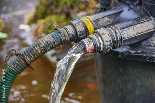 Wallpaper Mural Old metal watering faucet for irrigating plants and flowers in the garden or backyard Torontodigital.ca