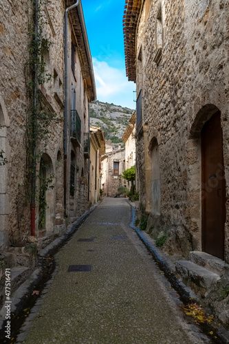 Saint-Guilhem-le-Desert in France, view of the village, typical street and houses 