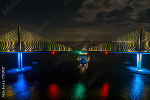 Drone panorama of Sunshine Skyway Bridge over Tampa Bay with passing cruise ship