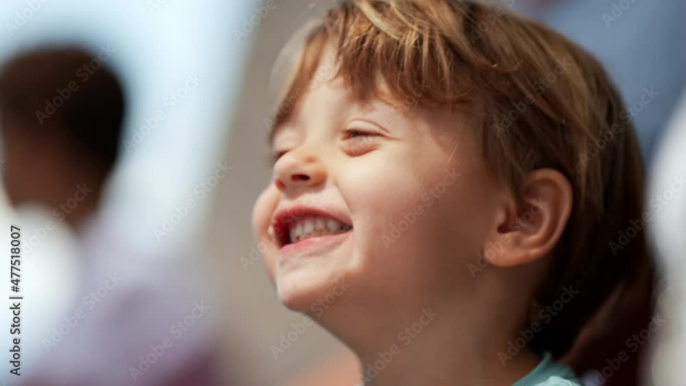 Playful little boy opening mouth with food inside. mischievous child misbehaving Playful little boy opening mouth with food inside. mischievous child misbehaving