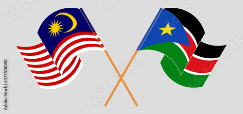 Photography Crossed and waving flags of Malaysia and South Sudan