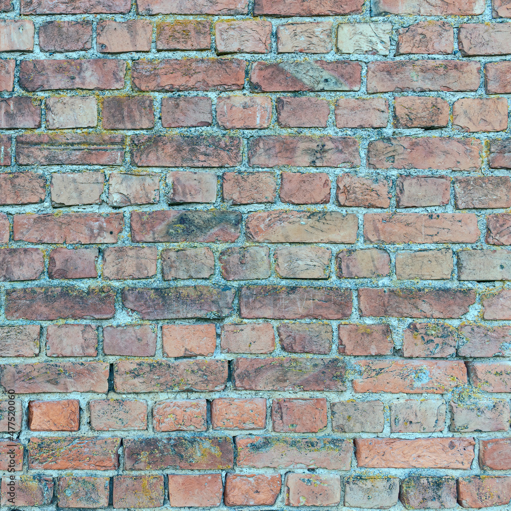 Fototapeta premium old stone wall made of weathered bricks as background