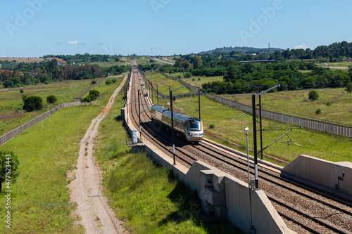 Gautrain, high speed train traveling from Pretoria to Sandton going past Solomon Mahlangu drive, Gauteng, South Africa. photo