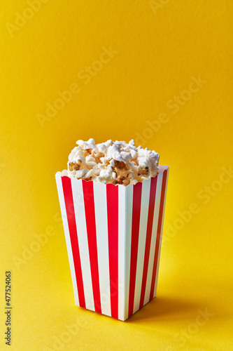  Pack of salty popcorns on a yellow background