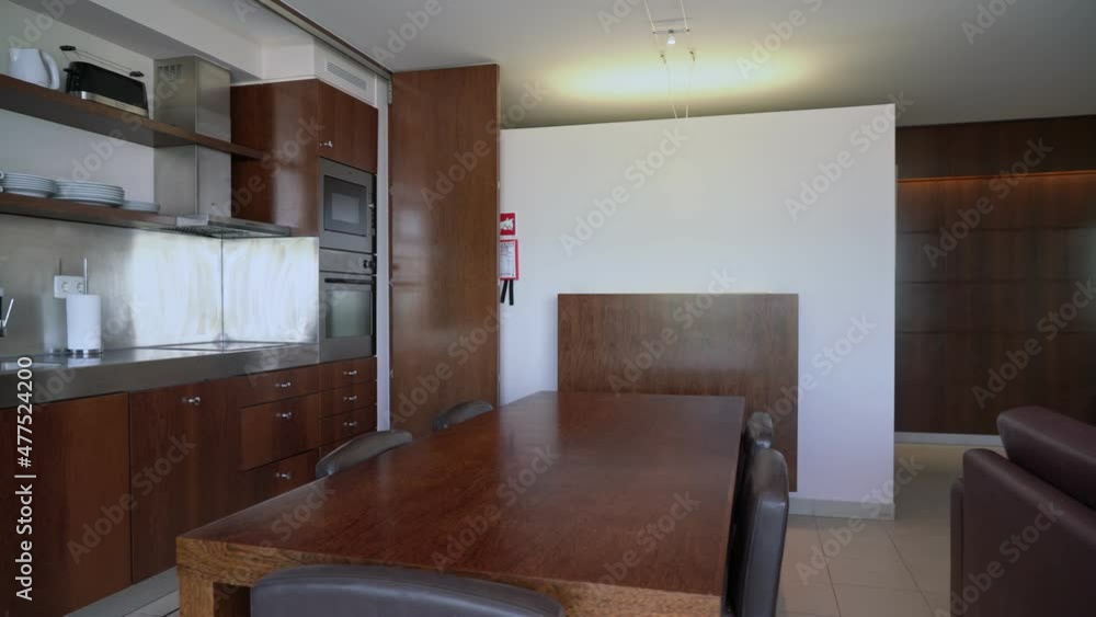 A modern duplex kitchen room with a living room equipped for tourists in the hostel hotel. Panorama in motion.