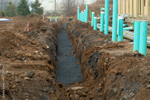 Laying of cables and pipes in the trench water