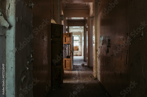 Dark and creepy corridor of old abandoned mental hospital © Mulderphoto