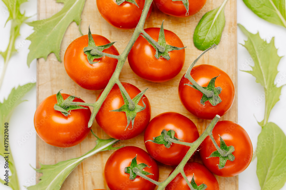 Healthy fresh tomatoes on a white background. Top view. salat with tomatoes cherry. Mediterranean salad with cherry tomatoes. Greece Healthy fresh tomatoes on a white background. Top view. salat with tomatoes cherry. Mediterranean salad with cherry tomatoes. Greece
