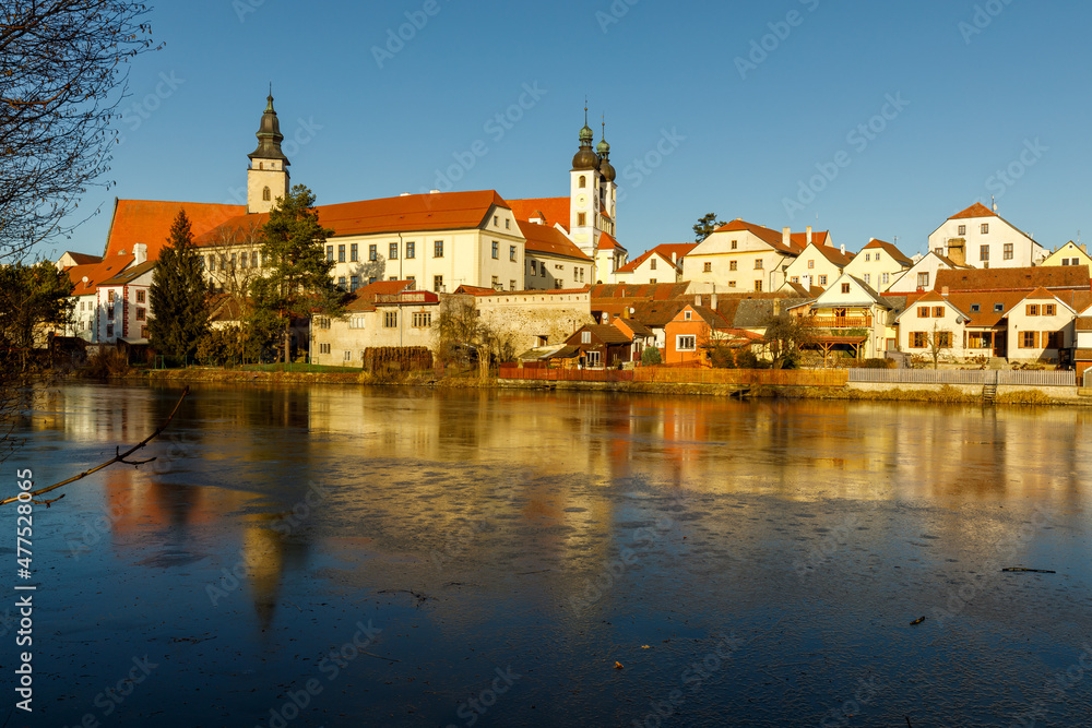 Castle Park and Telc Castle. View of the city of Telc in the winter sunset.
The picturesque castle and the historic center with the decorative facades of the houses belong to the UNESCO World Heritage