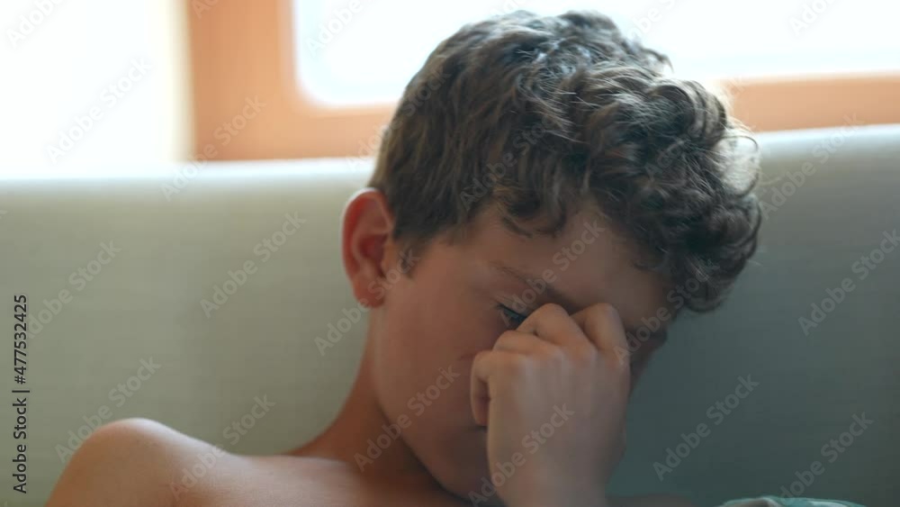 Young boy shutting down suffering in silence Young boy shutting down suffering in silence