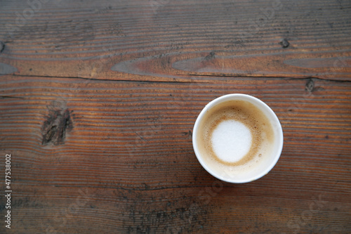 Hot cafe latte on wooden table