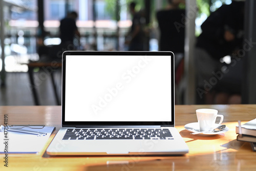 Wallpaper Mural Front view computer laptop, coffee cup and document on wooden table in office. Torontodigital.ca