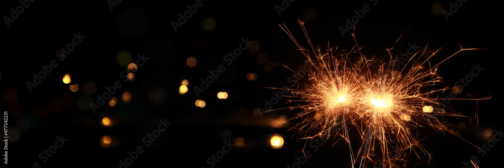 Happy New Year background with glowing sparklers. Happy New Year background with glowing sparklers.