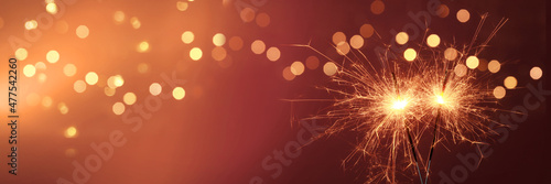 Fotografie, Obraz Happy New Year background with glowing sparklers.