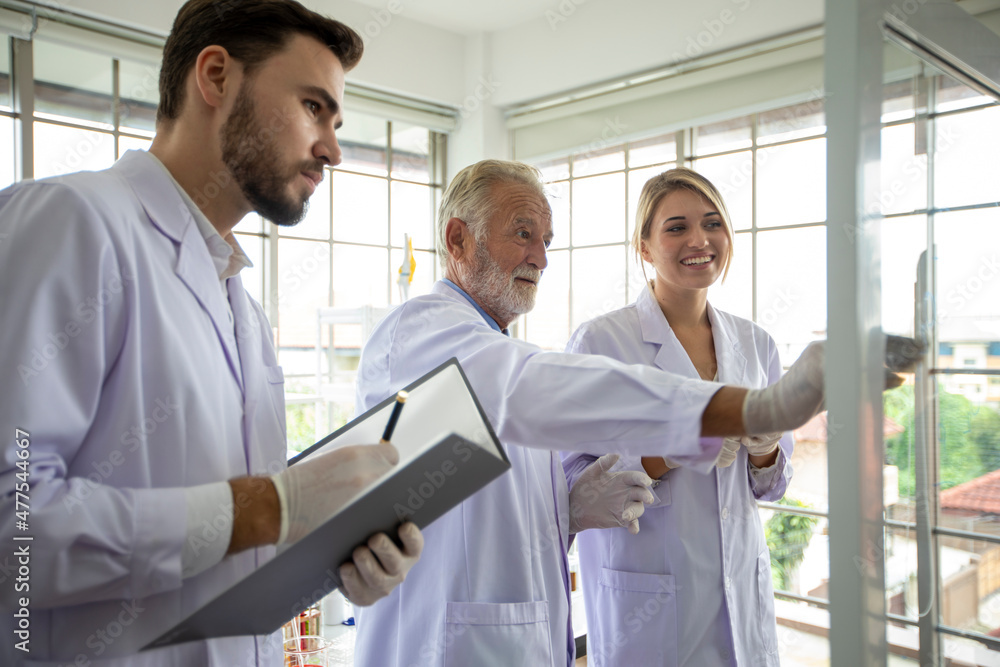 Medical Research and Scientists are working with a microscope and a tablet and Test Tubes, Micropipette and Analysis Result in a laboratory. Medical Research and Scientists are working with a microscope and a tablet and Test Tubes, Micropipette and Analysis Result in a laboratory.