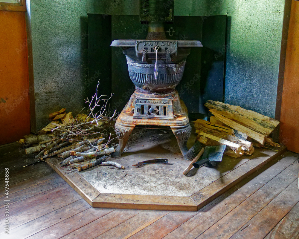 Masport Fatso pot belly stove in a tramping hut in New Zealand. Stock Photo  | Adobe Stock