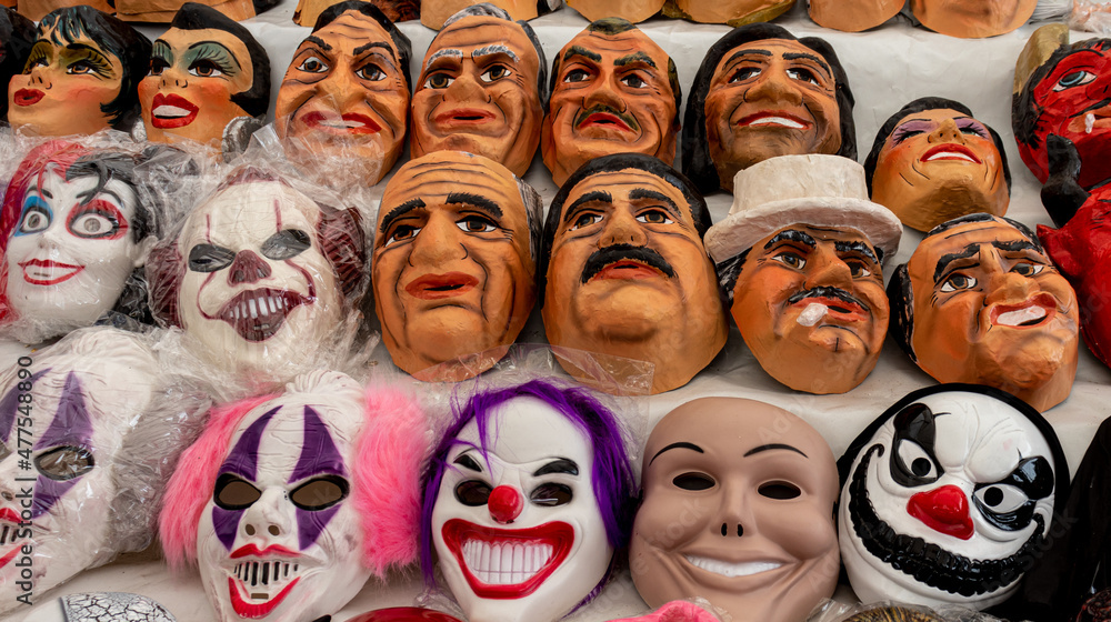 Fun and political masks made from papier mache for sale at the street