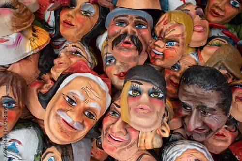 Fun and political masks made from papier mache for sale at the street market for Monigotes or Paper Mache dummies to be burn out to celebrate New Year's Eve
