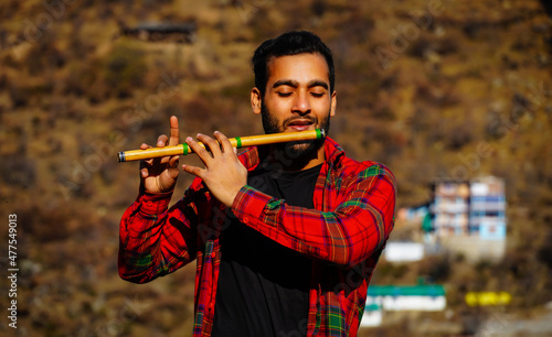 bansuri indian instrument man with flute indian bansuri Close view image photo