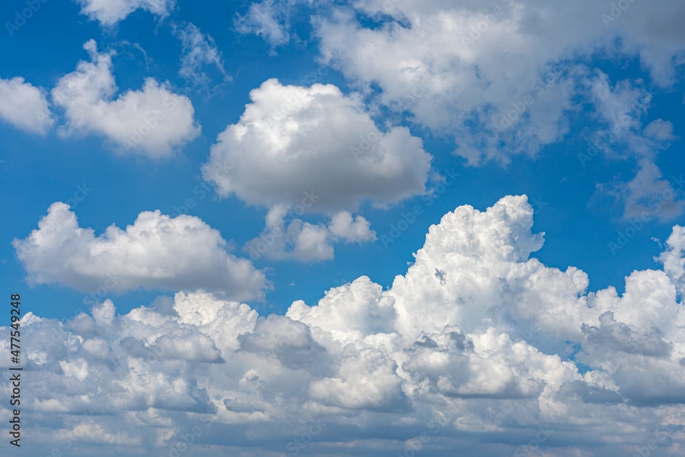 White clouds floating in the blue sky background White clouds floating in the blue sky background