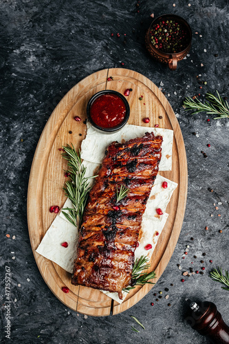 Fotografie Grilled pork ribs with BBQ sauce