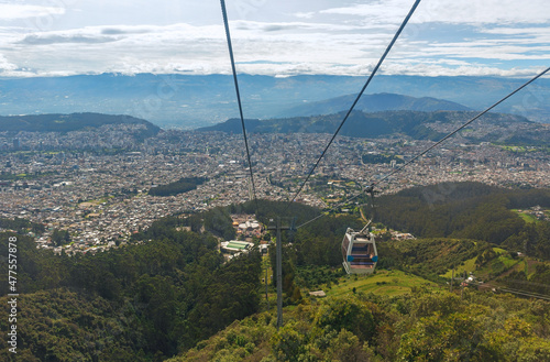 Cable car system on the Pichincha volcano named Teleferiqo with the skyline of Quito, Ecuador.