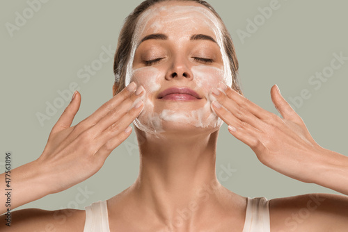 Soap face woman clean skin beauty. Color background. Green