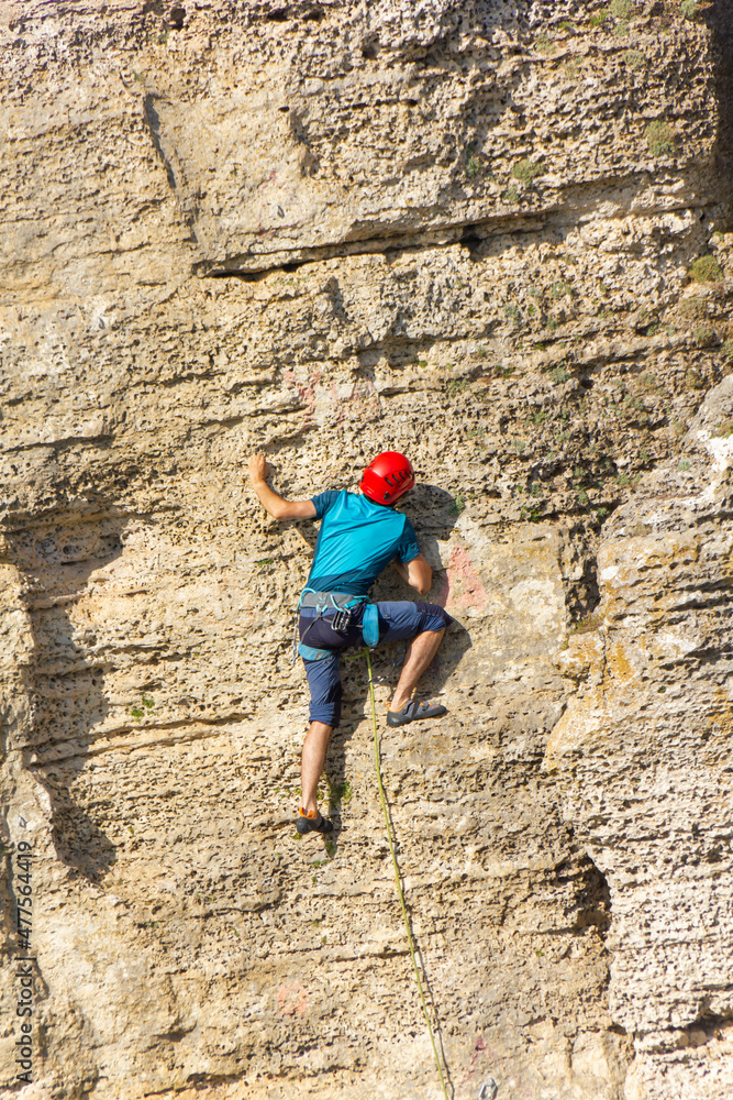 climber climbs the cliff alone