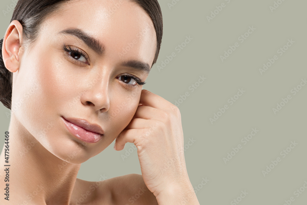 Asia woman beauty face body portrait touching her face healthy skin. Color background. Green Asia woman beauty face body portrait touching her face healthy skin. Color background. Green