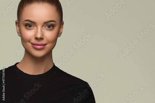 Beautiful woman black dress classic bob hairstyle over color background green Fotobehang