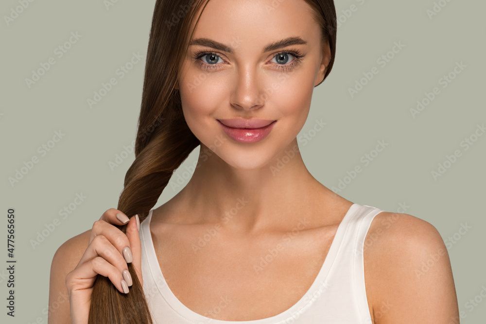 Beautiful woman with long smooth healthy hair tail beauty casual style. Color background green Beautiful woman with long smooth healthy hair tail beauty casual style. Color background green