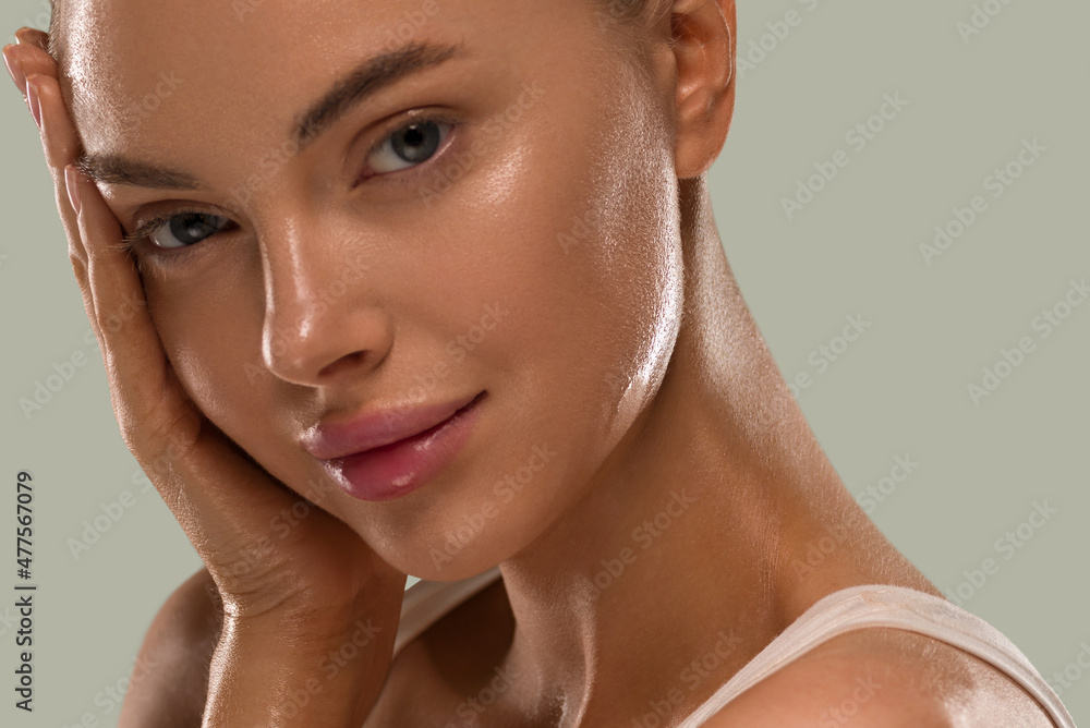 © Utkamandarinka - Beauty woman with hands healthy  natural make up clean fresh skin concept color background green