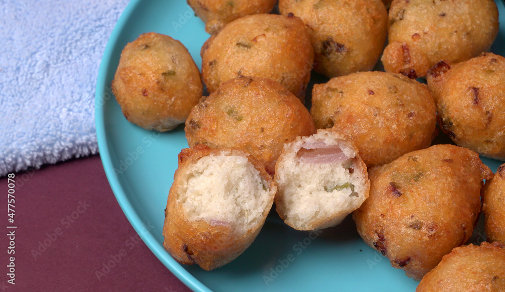 Fototapeta premium Delicious Indian snacks Punugulu served in a plate with Tomato and green Chutney
