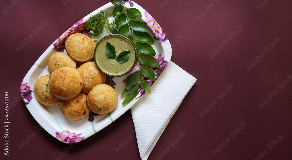 Appum or Appe, Appam or Mixed dal or Rava Appe served with green chutney. A Ball shape popular south Indian breakfast dish, Selective focus
Appum or Appe, Appam or Mixed dal or Rava Appe served with green chutney. A Ball shape popular south Indian breakfast dish, Selective focus