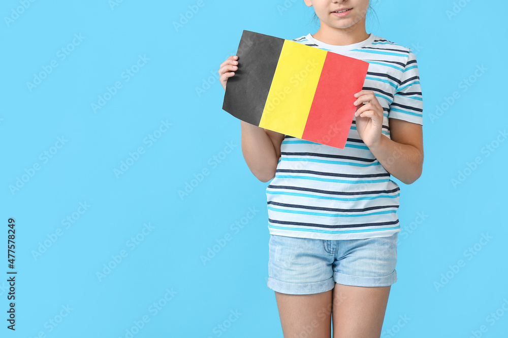 Little girl with flag of Belgium on color background Little girl with flag of Belgium on color background